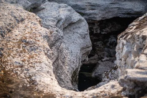 High-angle view looking down into a deep, rocky chasm of the dry Cijevna River Stock Photos
