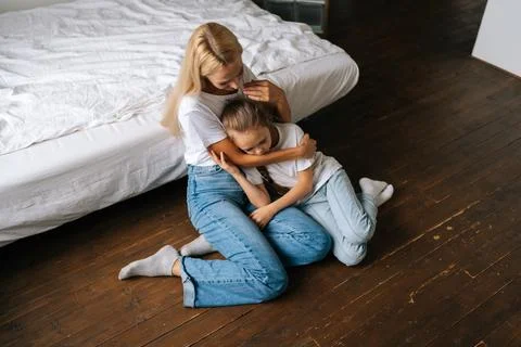 High-angle view of loving caring mother comforting offended unhappy little Stock Photos