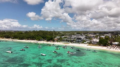 High Angle View of Luxury Boats on Crystal Clear Water by a Popular Beach Stock Footage 308106613