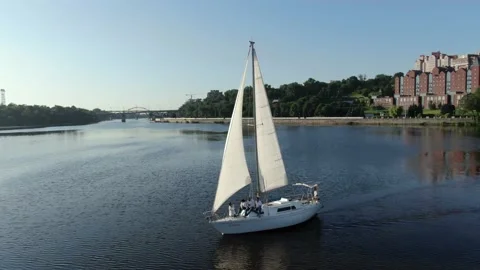 High angle view of a luxury sailing yacht in the river, city buildings, 4k Stock Footage 161721180