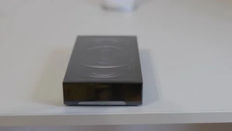 High angle view of a male hand turning an iPhone 12 Pro Max Graphite box in Video stock 162520482