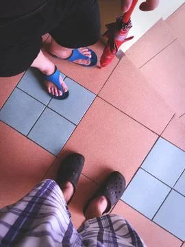 High Angle View of Man and Woman with Shoes Stock Photos