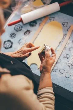 High Angle View Of Man Cutting Cookie Dough Stock Photos