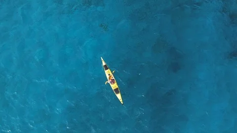 High angle view of man paddling sea kayak Stock Footage