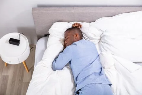 High Angle View Of Man Sleeping On Bed Stock Photos