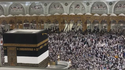 High-angle view of massive Muslim crowd performing Umrah around the Kaaba Stock Footage 340195015