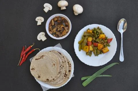 High angle view of matar paneer mix veg, mushroom soup and roti (Indian bread)  Stock Photos