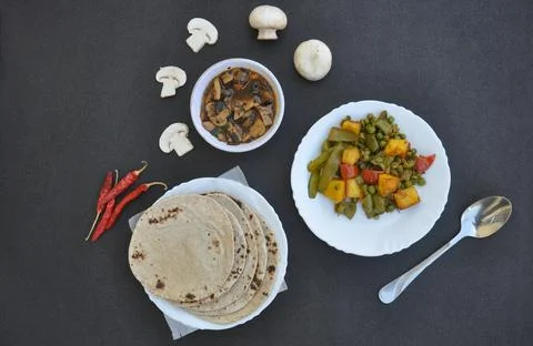 High angle view of matar paneer mix veg, mushroom soup and roti (Indian bread)  Stock Photos