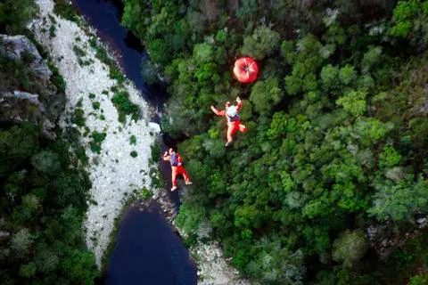 High angle view of men BASE jumping Foto stock