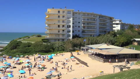 High-angle view of Milady beach, seaside restaurant, and oceanfront apartments Stock-Footage 341599494