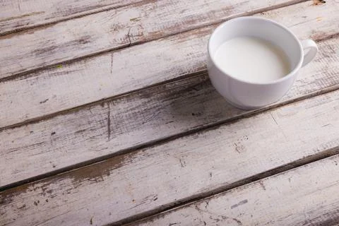 High angle view of milk in cup on wooden table, copy space Stock Photos