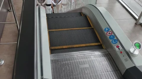 High Angle View of a Modern Escalator Moving Down in a Public Building Stock Footage 318022955