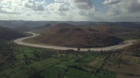High Angle View of Modern Highway Cutting Through Countryside Hills in Lombok Stock Footage 344923772
