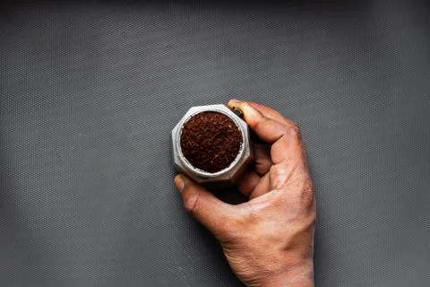 High angle view of moka express with ground coffee in a studio at day time Stock Photos