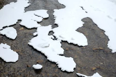 High angle view of montain river  partially covered with snow  during winter Stock Photos