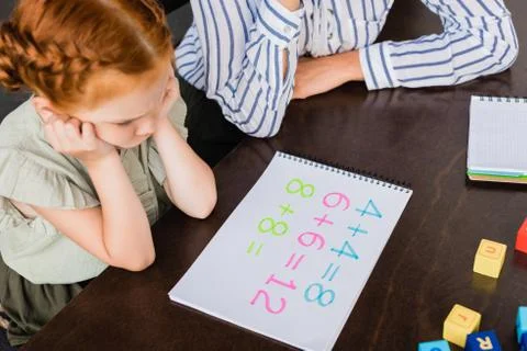 High angle view of mother and daughter learning math Stock Photos