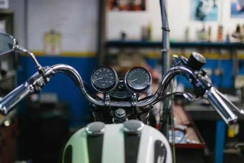 High angle view of motorcycle in auto repair shop Photos
