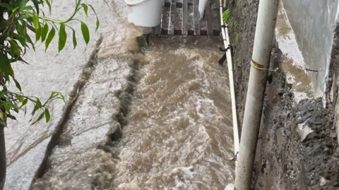 High angle view of muddy flood water overflowing . Stock Footage 323721528