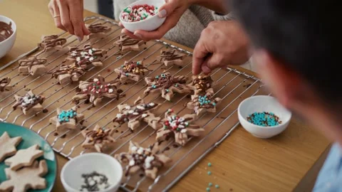 High angle view of multi ethnicity couple decorating sweet cookies Stock-Footage 218776895