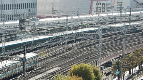 High angle view of multiple trains moving through Tokyo station railway network Stock Footage 331296715