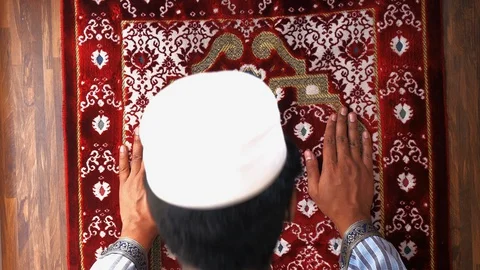 High angle view of muslim man praying Stock Footage 128857498