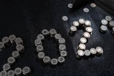 High angle view of New Years 2021 as Swiss coins on a black background. Stock Photos