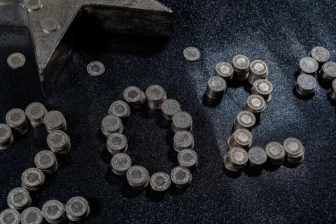 High angle view of New Years 2021 as Swiss coins on a black background. Stock Photos