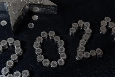 High angle view of New Years 2021 as Swiss coins on a black background. Stock Photos