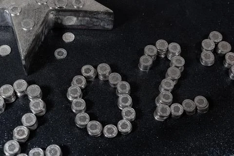 High angle view of New Years 2021 as Swiss coins on a black background. Foto stock