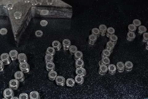 High angle view of New Years 2021 as Swiss coins on a black background. Stock Photos