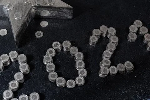 High angle view of New Years 2021 as Swiss coins on a black background. Stock Photos