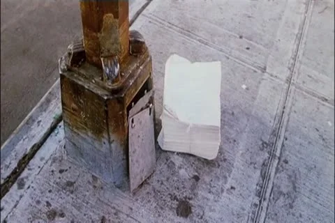 High angle view newspaper bundles thrown on sidewalk Video stock 11348225