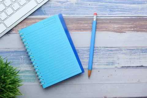High angle view of notepad with pencil on table Stock Photos