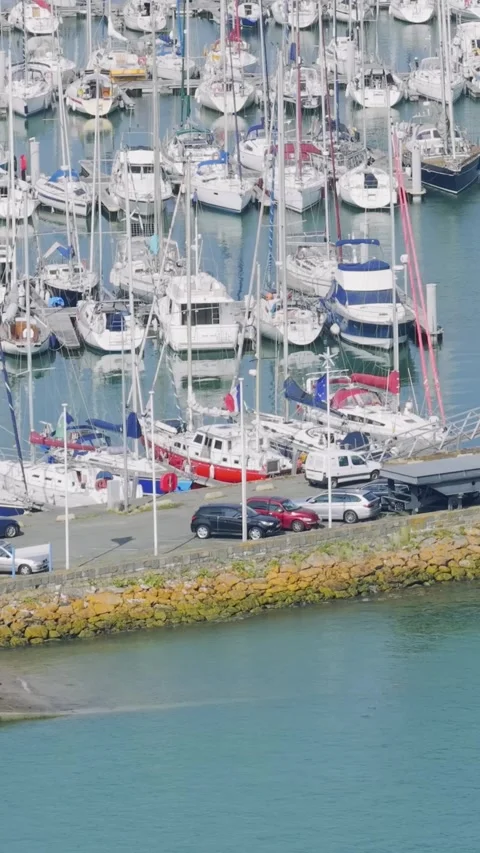 A high-angle view of numerous sailboats and yachts docked in the marina at Binic Stock Footage 346663656