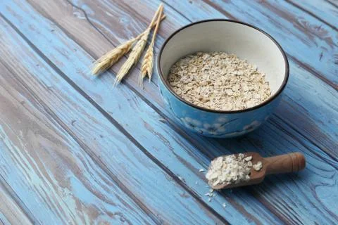 High angle view of oats flakes on in a bowl on table Stock Photos