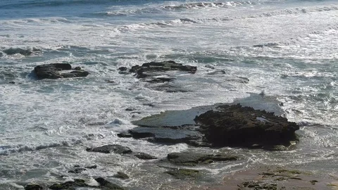 High angle view of ocean waves breaking onto rocks near Wilderness, South Africa Stock Footage 122104230