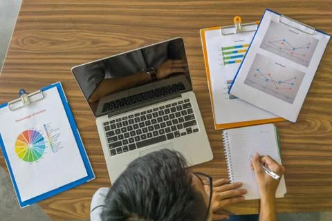 High angle view of office man writing notes in office Stock Photos