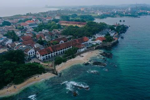High angle view of an old coastal settlement with historic red-roofed colonial Stock Photos