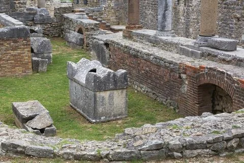 High angle view of old semi circle grey stone structure, terracotta brick wall Stock Photos