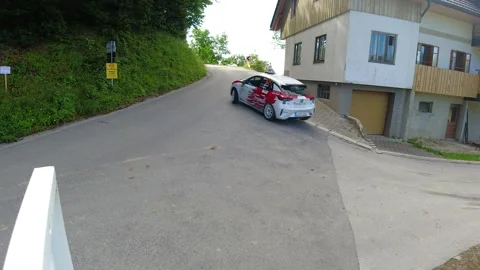 High angle view of an Opel Corsa Rally4 rally car takes a sharp turn Stock Footage 255436484