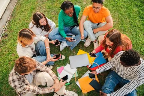 High angle view or aerial of a group of students sitting on a circle at the Stock Photos
