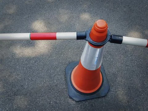High Angle View of Orange Traffic Cone with Tubular Bars as Fence Stock Photos