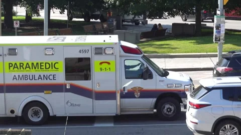High angle view of an Ottawa Paramedic ambulance driving through a downtown Stockbeeldmateriaal 347577229