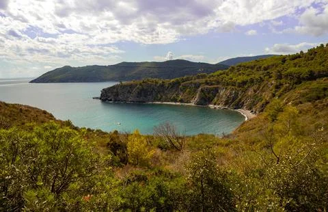 High angle view over Acquarilli Beach, a dark sand beach for nudist situated in Stock Photos