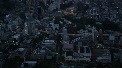 High angle view over city buildings and streets in Central Tokyo, at night Stock Footage 40648980