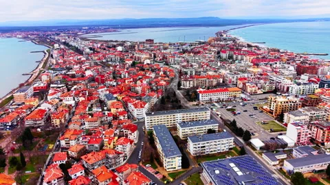 High angle view over city rooftops toward Pomorie Lake, Bulgaria Stock Footage 336343422