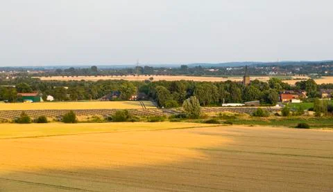 High angle view over fields to a large solar panel park providing renewable e Stock Photos
