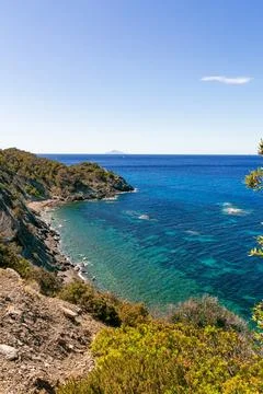 High angle view over Ogliera beach, a little wild free beach with dark sand Stock Photos