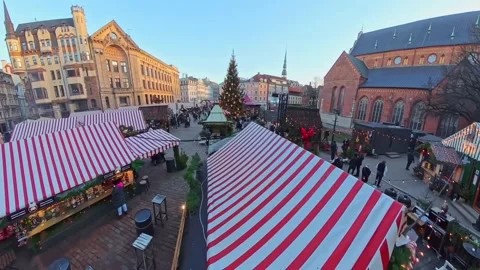 High-angle view over Riga’s Dome Square holiday market with a large Christmas Stock Footage 327451048