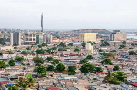 High angle view over slums of Luanda with Mausoleum of Agostinho Neto tower in Stock Photos